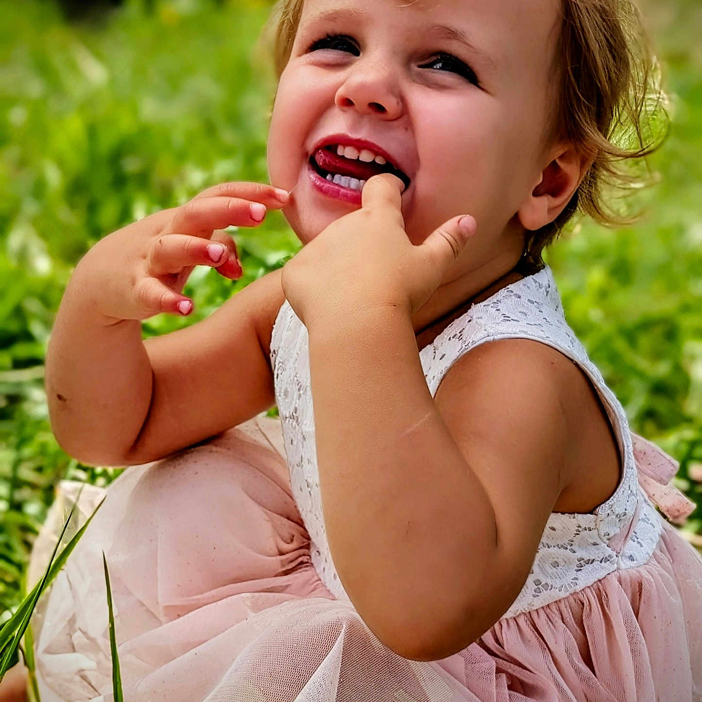 Emberleigh is registered to the contest to win money with this photo: child, toddler, smiling, dress, pink, outdoor, grass, happy, baby, cute, person, young, nature, playful, portrait, sunlight, sitting, face, innocence, joy