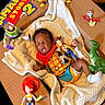 Amare is registered to the contest to win money with this photo: baby, blanket, buzz_lightyear, cardboard_box, character, cowboy, cute, doll, forky, indoor, infant, inflatable, jessie, playful, rex, sleeping, soft_texture, toy, toy_story, woody