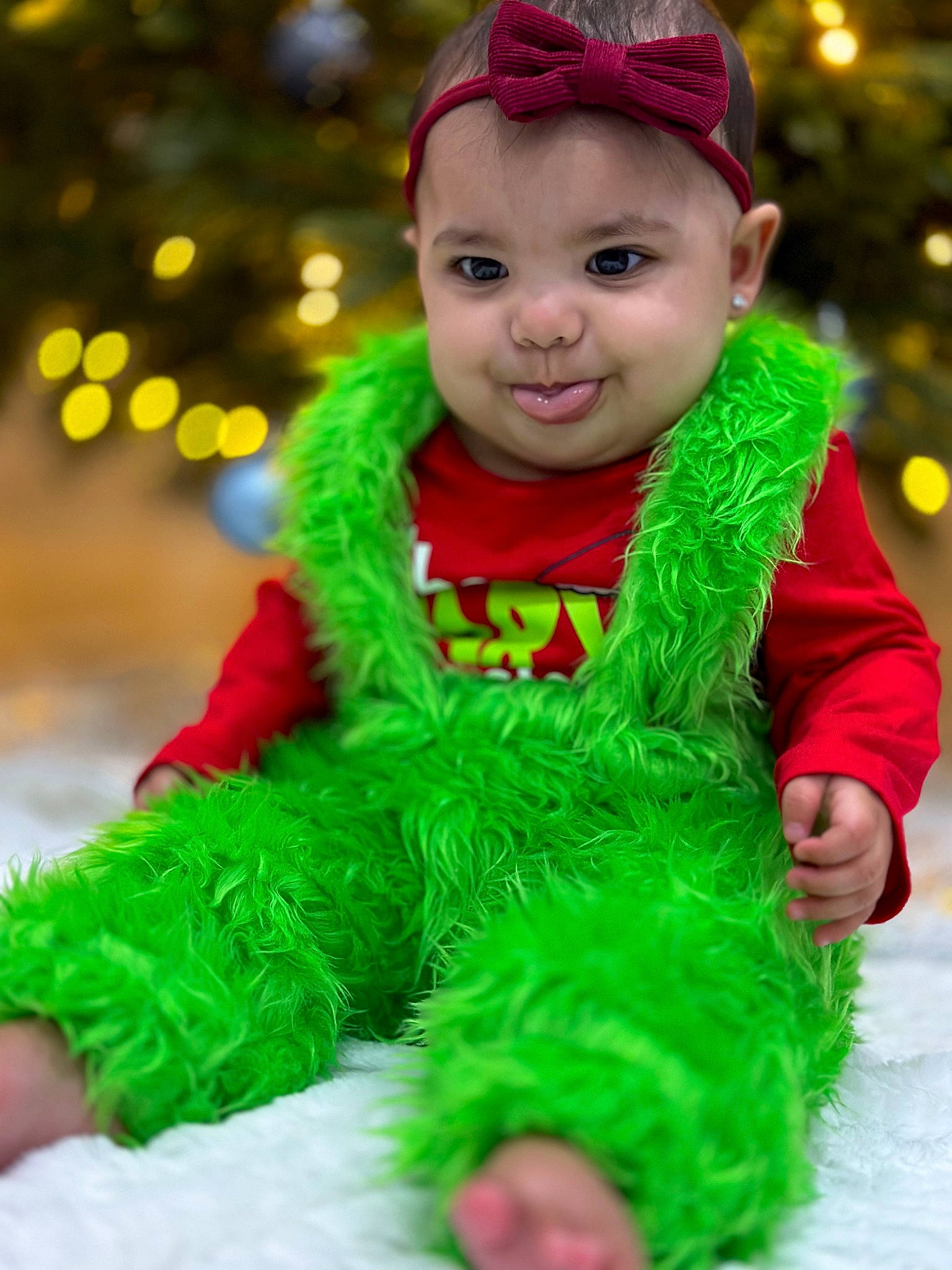 Amora joined the competition — help win amazing prizes! baby_toddler_clothing, child, christmas_decoration, christmas_ornament, costume_hat, event, fictional_character, fun, grass, green, happy, headwear, holiday, magenta, ornament, person, pink, red, smile, toddler