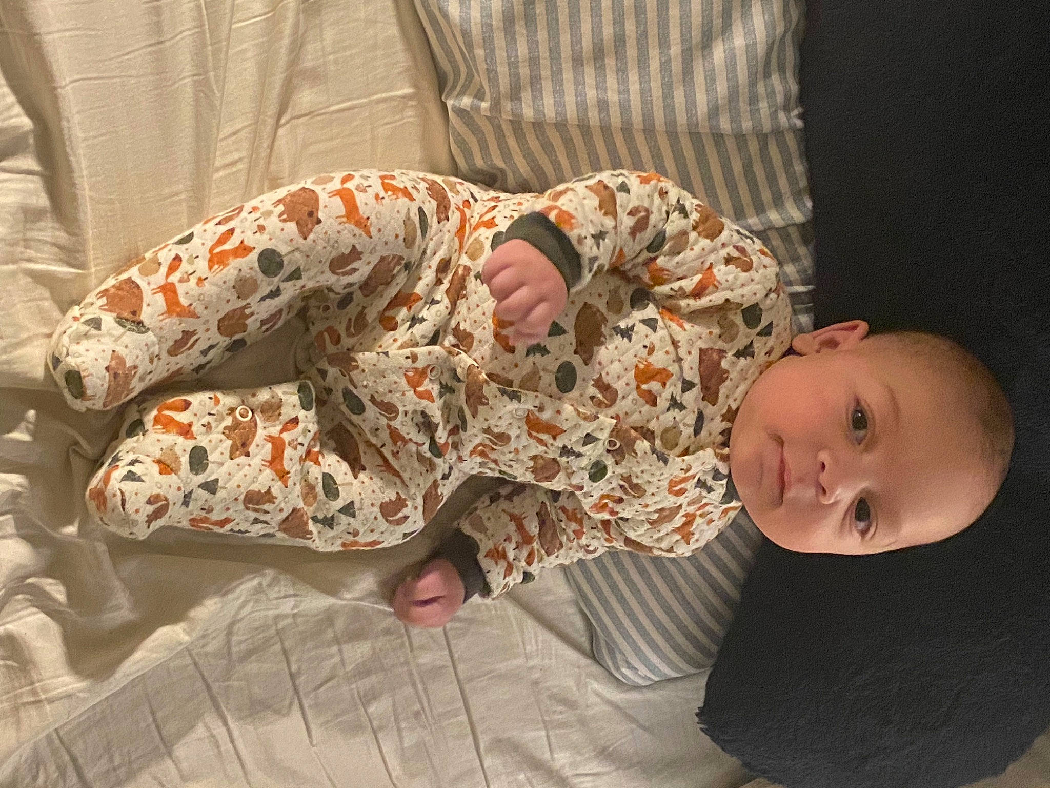 Henry joined the competition — help win amazing prizes! baby, baby_toddler_clothing, barefoot, bedtime, child, comfort, flooring, foot, human_leg, linens, nap, nightwear, pajamas, pattern, person, room, sitting, sleep, sleeve, thigh