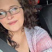 Aubriella joined the competition — help win amazing prizes! woman, child, car, seatbelt, glasses, ear_protection, knitted_sweater, curly_hair, portrait, indoor, vehicle_interior, seat, window, roadside, casual_clothing, smile, person, travel, family, daylight