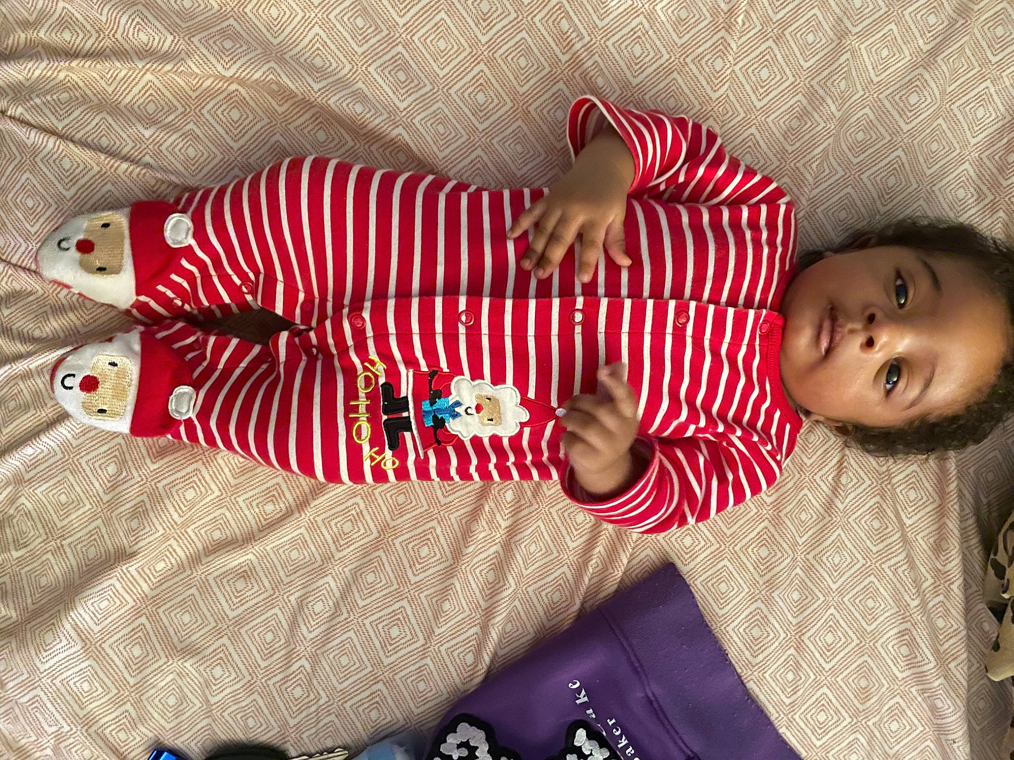 Dwight is registered to the contest to win money with this photo: baby, baby_toddler_clothing, carmine, child, comfort, foot, happy, human_leg, leg, linens, pattern, person, plaid, sitting, skin, sleeve, sock, textile, thigh, toddler