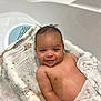 arm, baby, bath, bathtub, blanket, child, comfort, cute, face, happy, head, indoors, infant, relaxing, seat, skin, smiling, towel, wash, water