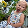 toddler, child, girl, blue_bow, dress, patterned_dress, outdoor, garden, plants, sunflower, porch, concrete, greenery, expression, yawn, scream, summer, nature, happy, casual