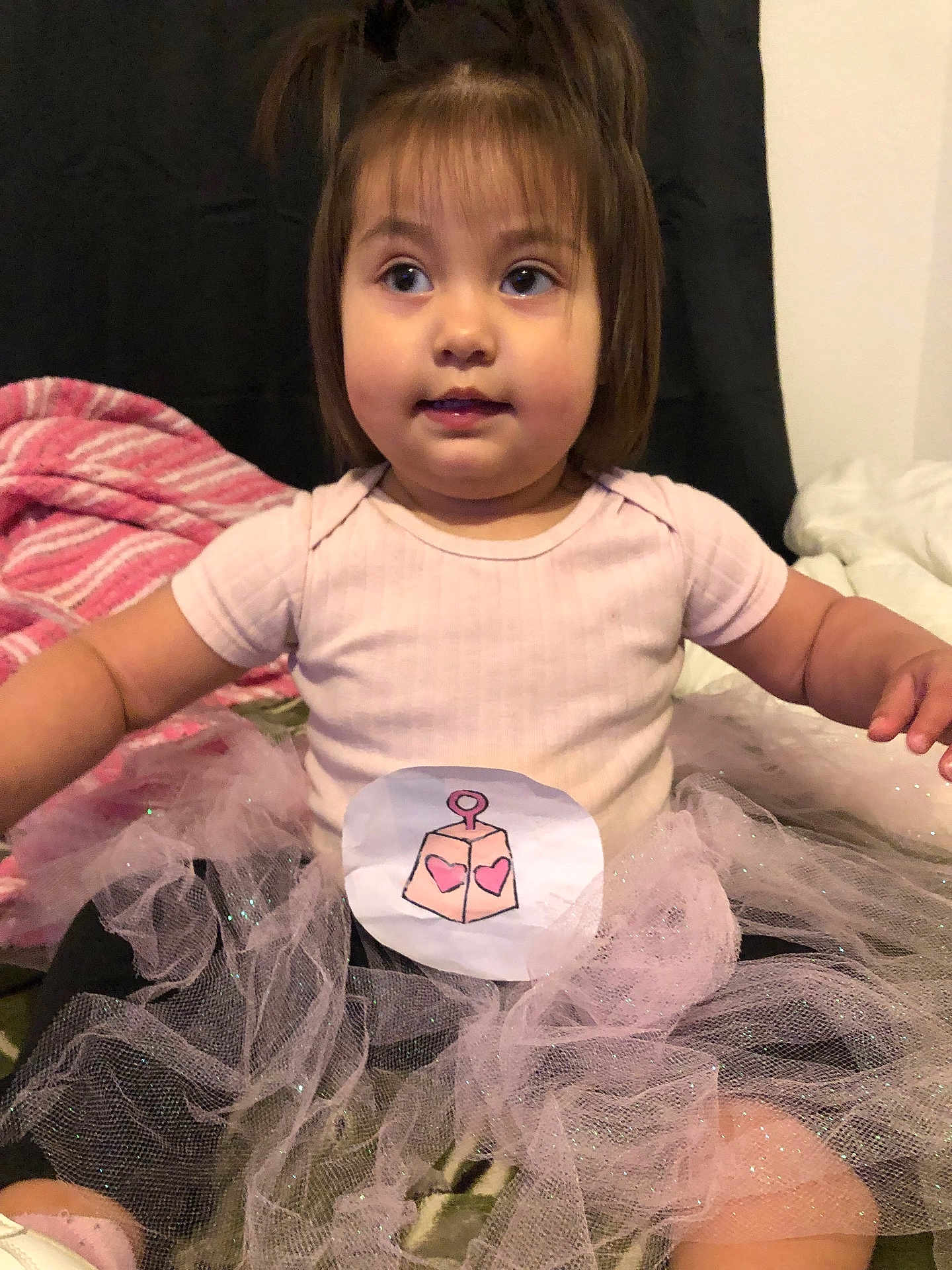 Ehlani is registered to the contest to win money with this photo: bodypart, child, clothing, couch, cushion, dress, face, female, finger, furniture, girl, hand, head, indoors, person, photography, portrait, sitting, skirt, t_shirt