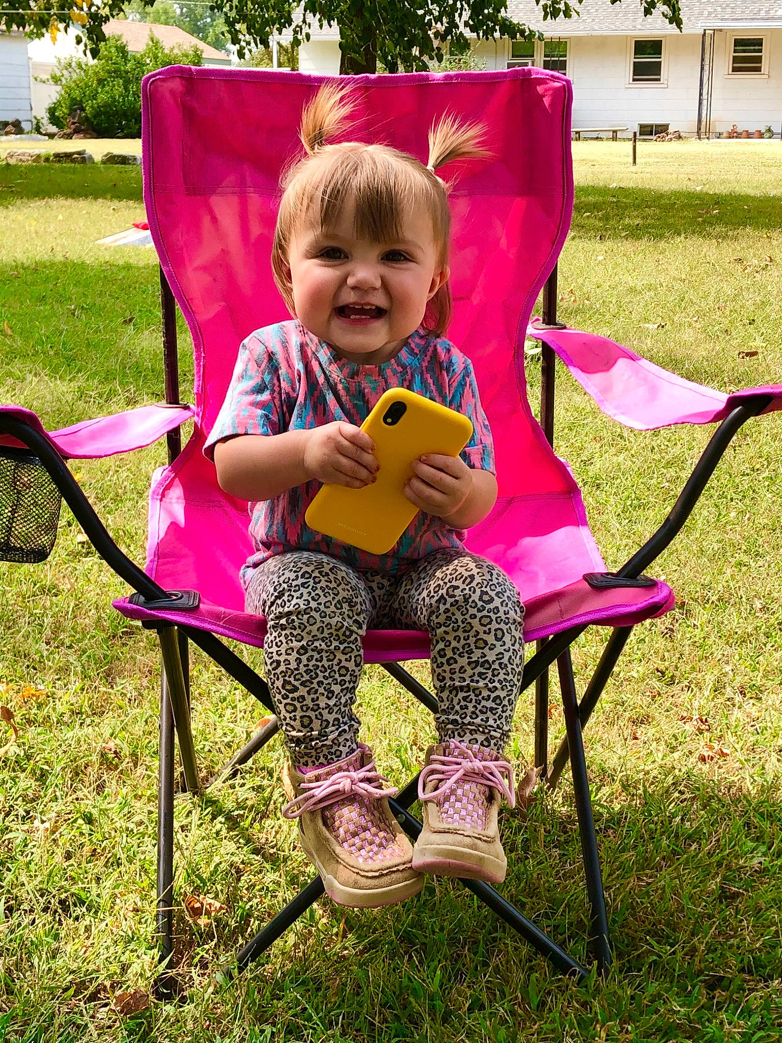 Lenora joined the competition — help win amazing prizes! chair, child, fun, furniture, grass, joy, lawn, leisure, magenta, person, pink, plant, product, recreation, sitting, smile, spring, summer, toddler, tree