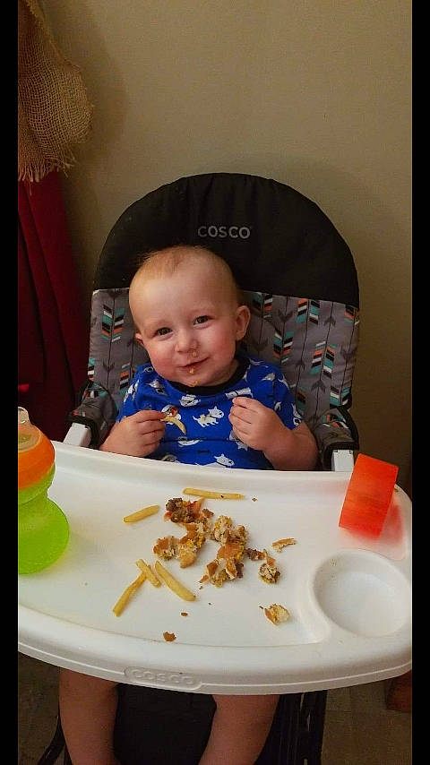 Zane is registered to the contest to win money with this photo: baby, baby_food, birthday, cheek, child, comfort_food, cuisine, dish, eating, food, meal, person, toddler
