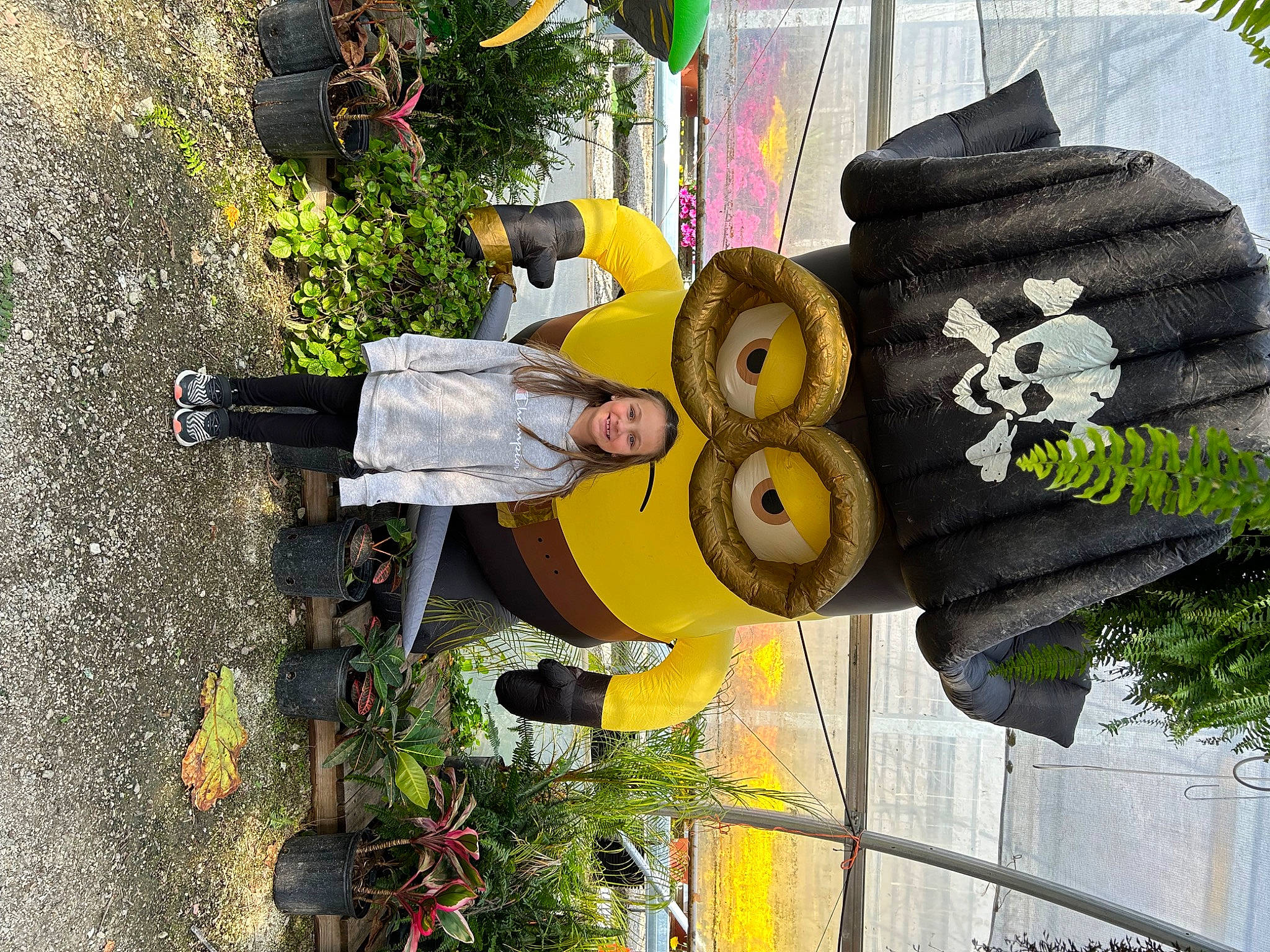 Emerie is registered to the contest to win money with this photo: art, auto_part, automotive_tire, automotive_wheel_system, hat, joy, person, plant, sculpture, sign, sun_hat, tire, tree, wheel, yellow