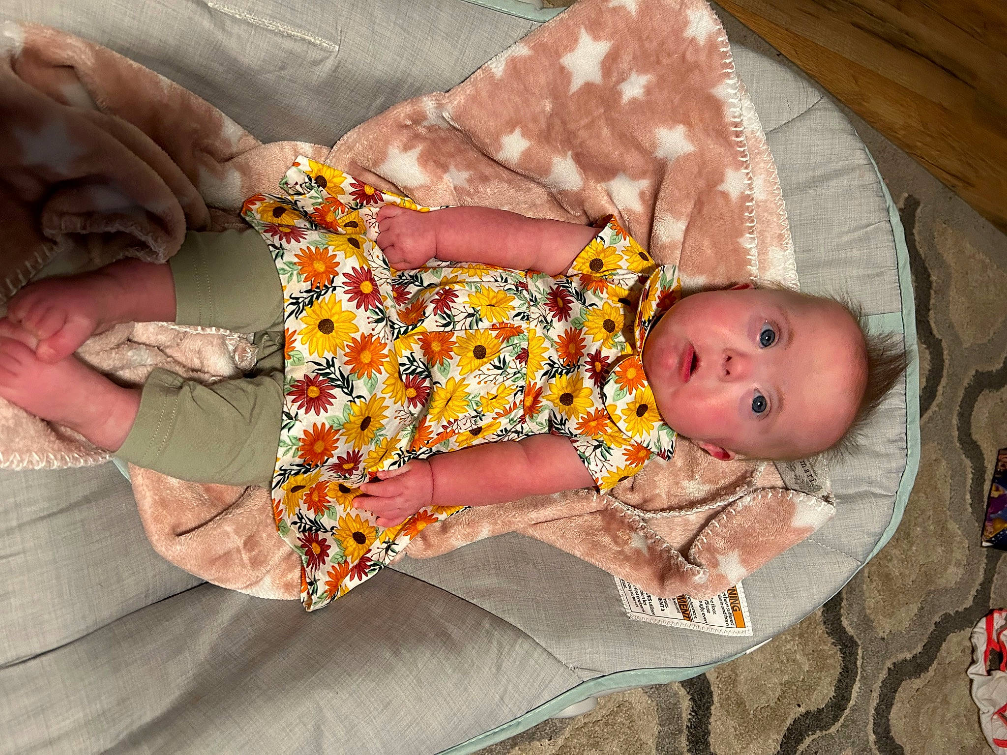 Maizie Grace joined the competition — help win amazing prizes! baby, baby_products, baby_sleeping, baby_toddler_clothing, bedtime, child, comfort, finger, foot, hand, head, human_body, human_leg, lap, linens, pattern, person, sitting, surprise, textile
