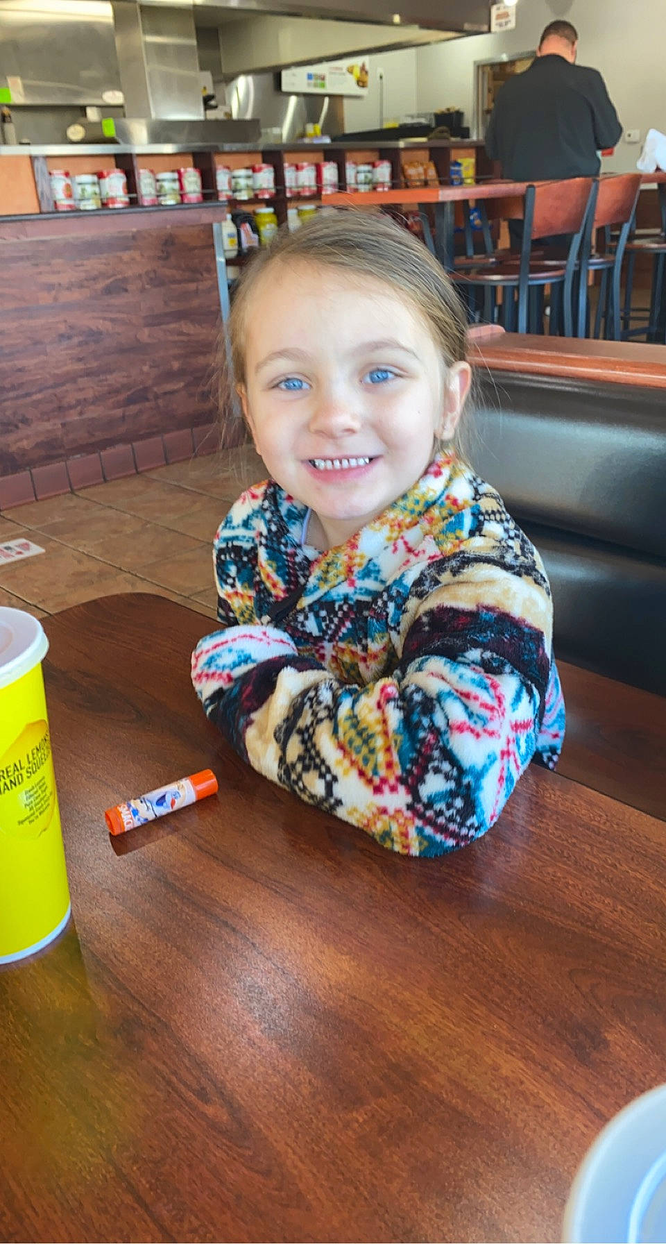 Emerie joined the competition — help win amazing prizes! baby_toddler_clothing, chair, child, eye, floor, flooring, fun, happy, hardwood, joy, leisure, person, shelf, sitting, sleeve, smile, t_shirt, table, toddler, under_exposed