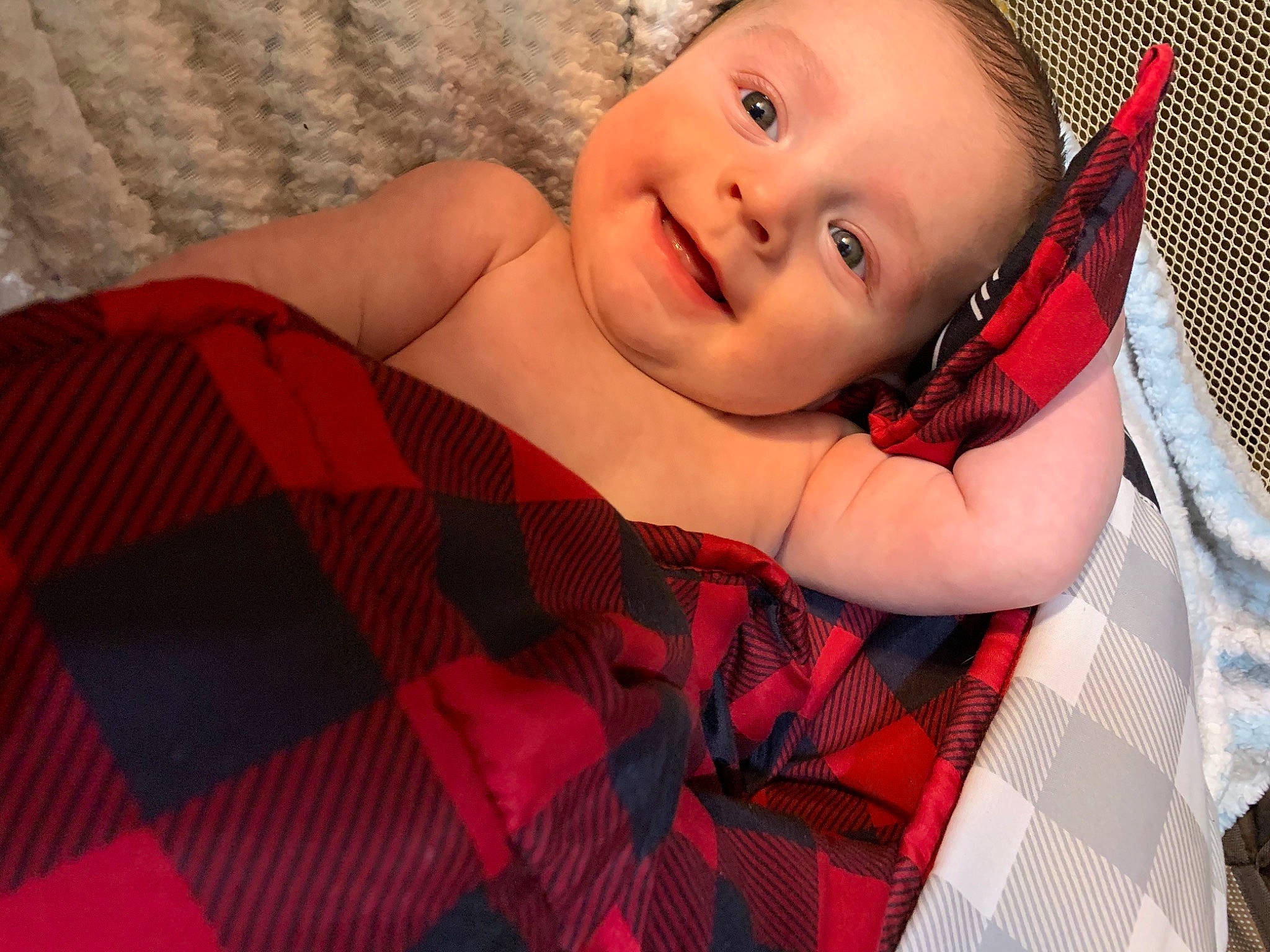 Hunter is registered to the contest to win money with this photo: baby, baby_toddler_clothing, comfort, eye, flash_photography, happy, iris, lip, mouth, orange, pattern, person, pink, plaid, red, skin, smile, tartan, textile, toddler