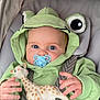 Mylann participe au concours pour gagner de l'argent avec cette photo : baby, child, pacifier, hoodie, green_clothing, giraffe_toy, car_seat, seatbelt, infant, cute, blue_eyes, hand, soft_toy, baby_girl, baby_boy, clothing, portrait, indoor, close_up, young_child