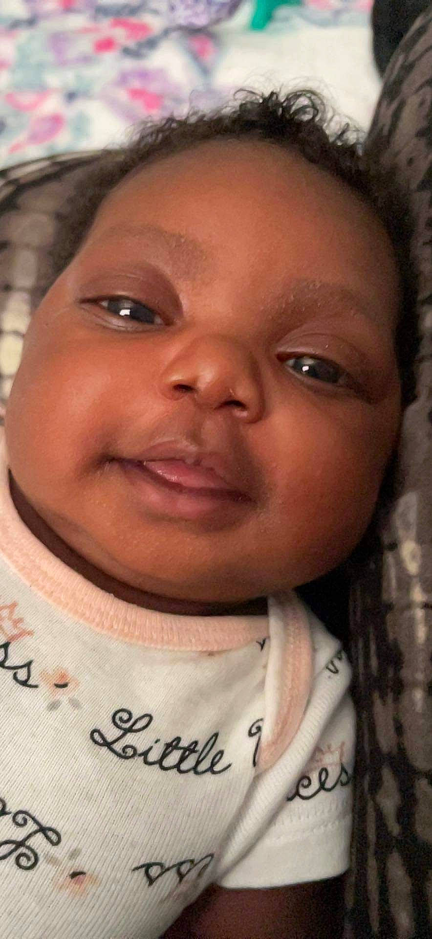 Saniyah is registered to the contest to win money with this photo: black_hair, cheek, child, chin, eyebrow, eyelash, facial_expression, forehead, fun, hairstyle, happy, human, iris, jaw, lip, mouth, nose, skin, sleeve, smile