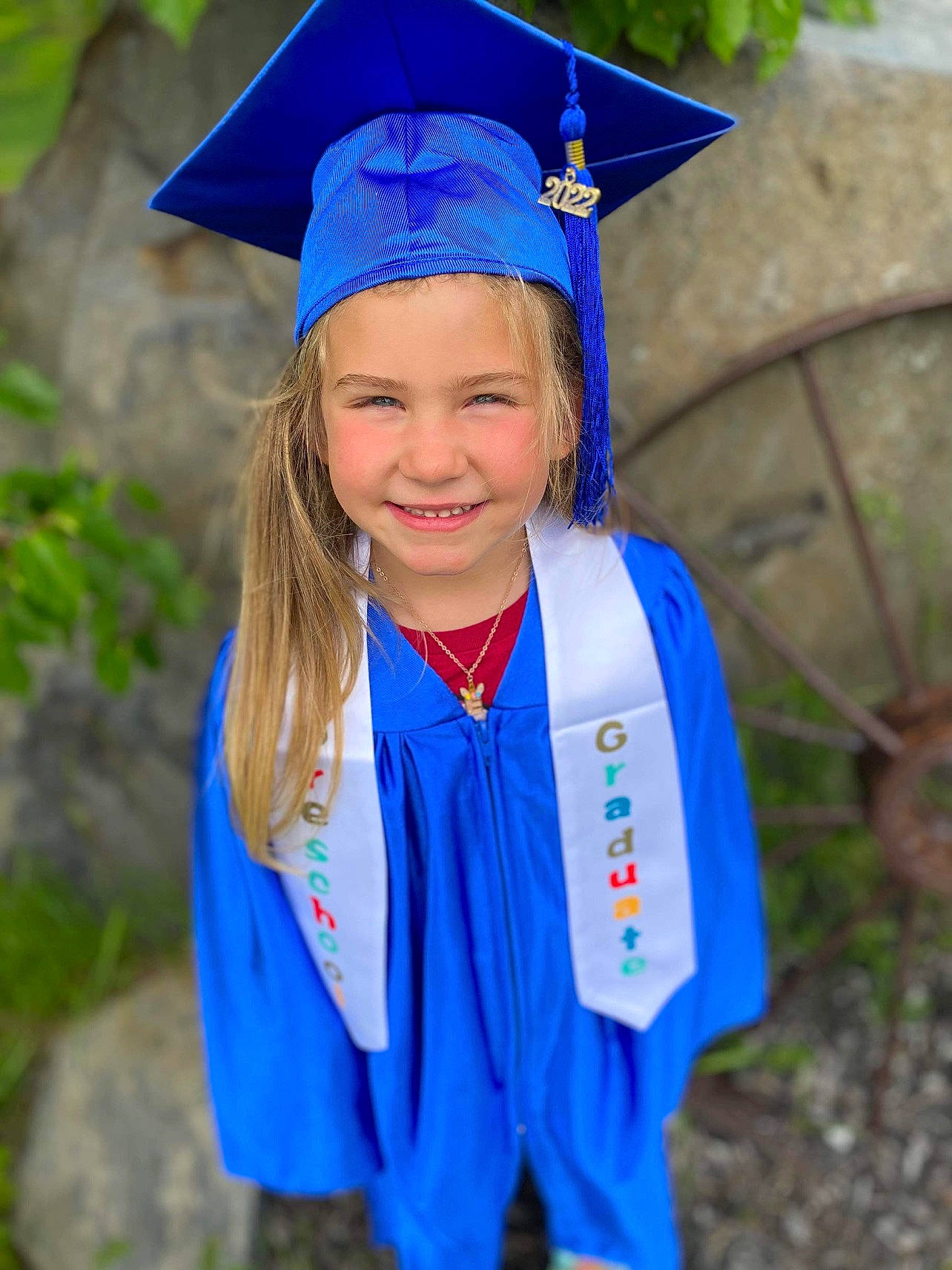 Emery is registered to the contest to win money with this photo: academic_dress, academic_institution, blue, electric_blue, event, face, fun, graduation, grass, happy, headgear, headwear, joy, mortarboard, nature, person, phd, public_event, scholar, sleeve