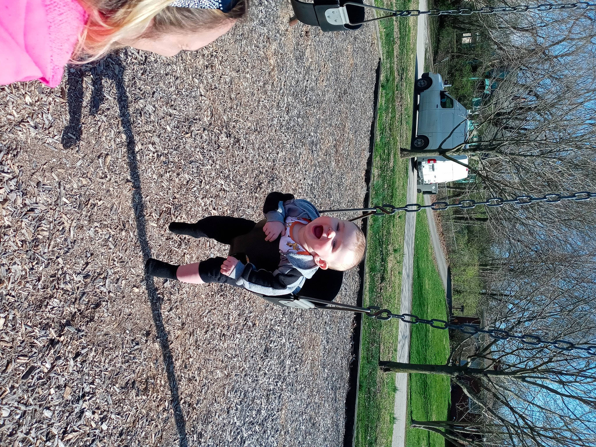 Tyson is registered to the contest to win money with this photo: adventure, asphalt, child, concrete, fun, grass, human_leg, landscape, leisure, person, plant, recreation, sandal, shadow, sky, soil, toddler, tree, vertebrate, walking_shoe