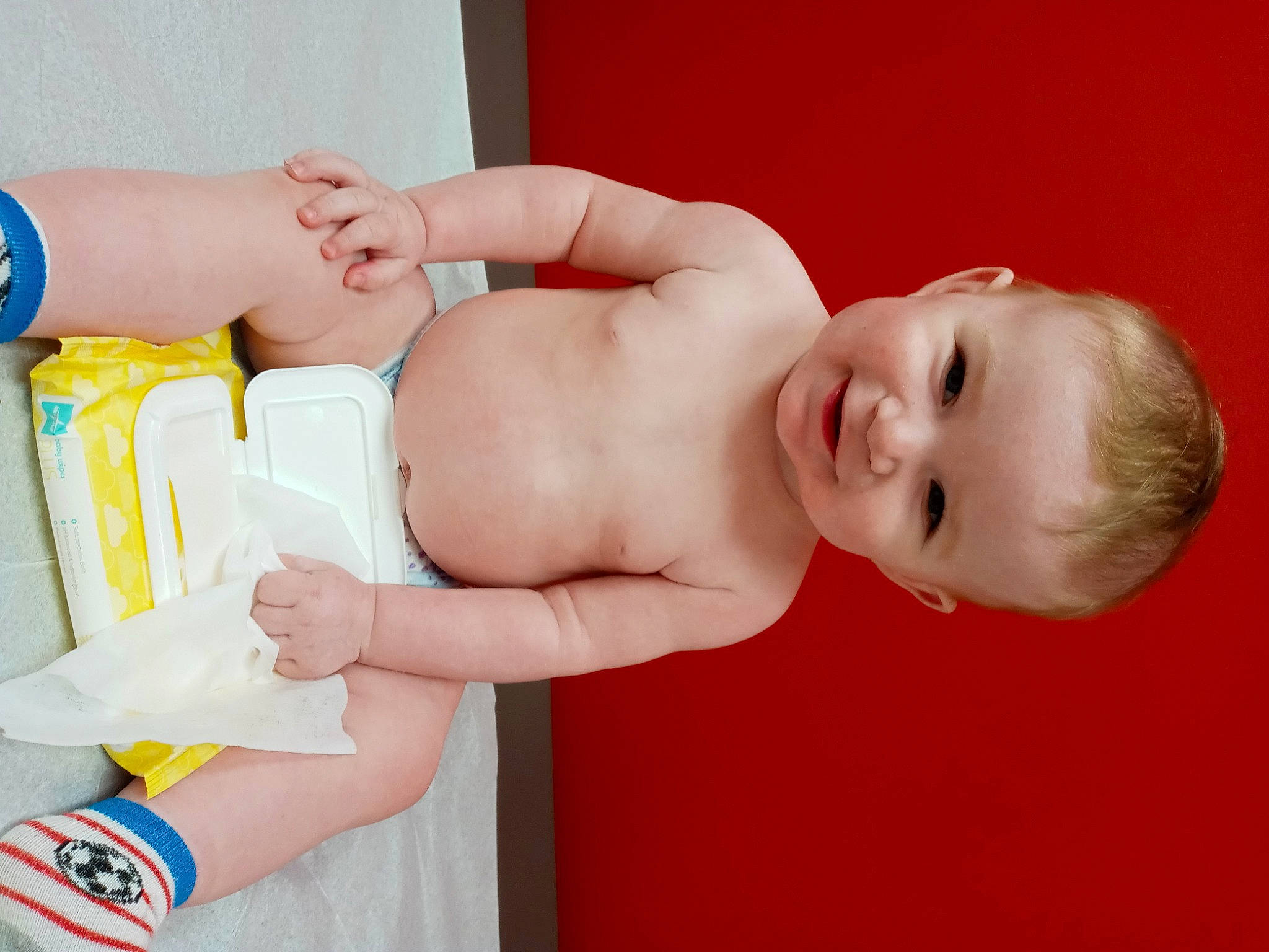 Tyson is registered to the contest to win money with this photo: arm, diaper, eye, finger, gesture, hair, hand, happy, human_body, joint, joy, leg, muscle, nail, neck, person, skin, smile, stomach, thigh