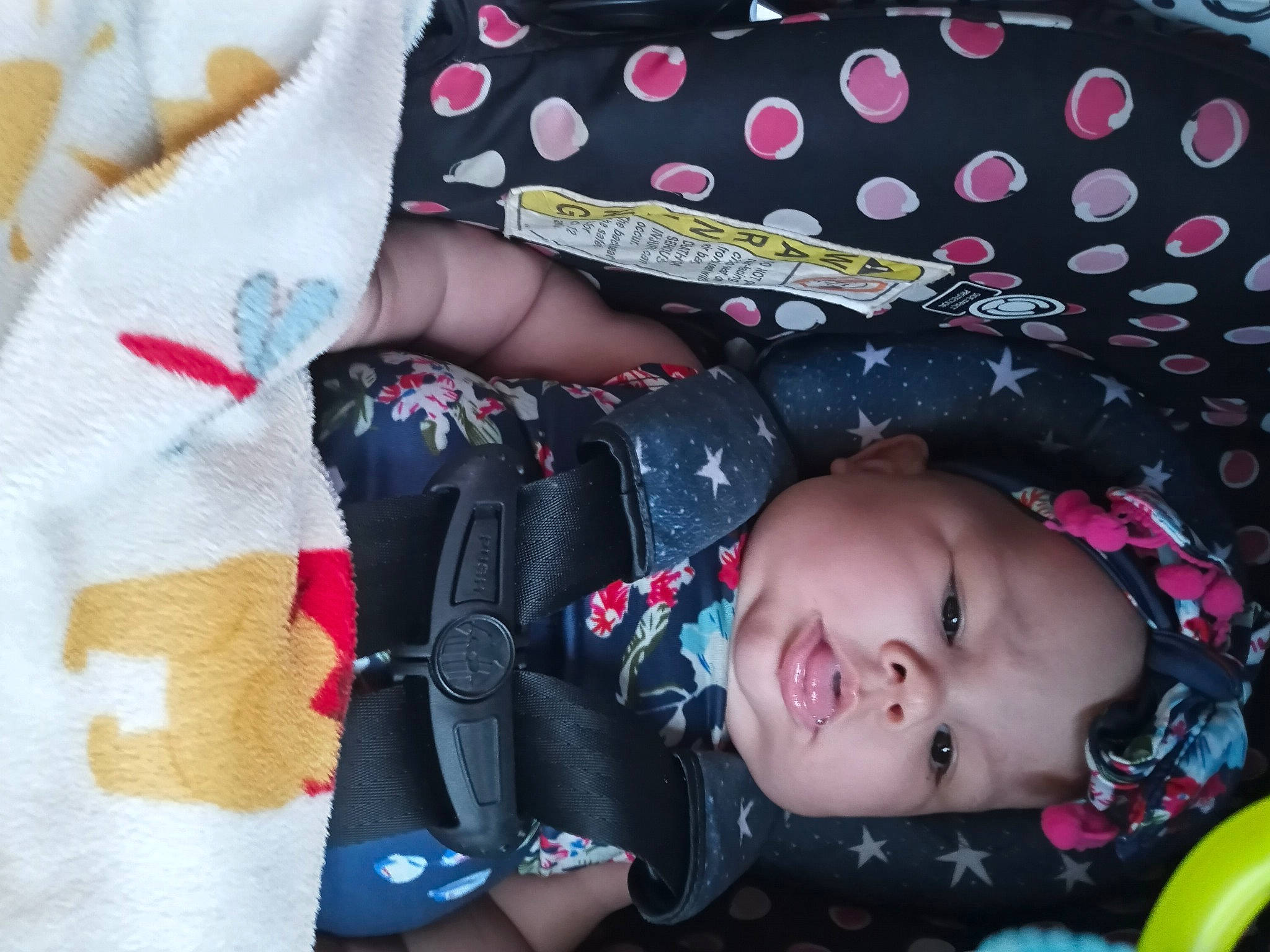 Izabelle is registered to the contest to win money with this photo: baby, baby_products, baby_toddler_clothing, beauty, black, cheek, child, comfort, fashion_accessory, headgear, headwear, pattern, person, pink, plant, skin, sleeve, smile, textile, toddler