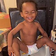 London joined the competition — help win amazing prizes! toddler, child, diaper, smiling, laughing, happy, indoor, chair, furniture, books, table, home, person, cute, baby, skin, sitting, playful, joy, expression