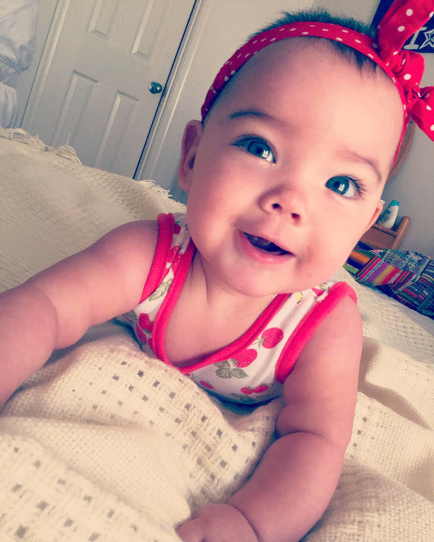 Valentina is registered to the contest to win money with this photo: baby, beauty, cheek, child, chin, ear, eye, eyebrow, face, facial_expression, forehead, head, lip, nose, organ, person, pink, product, skin, smile