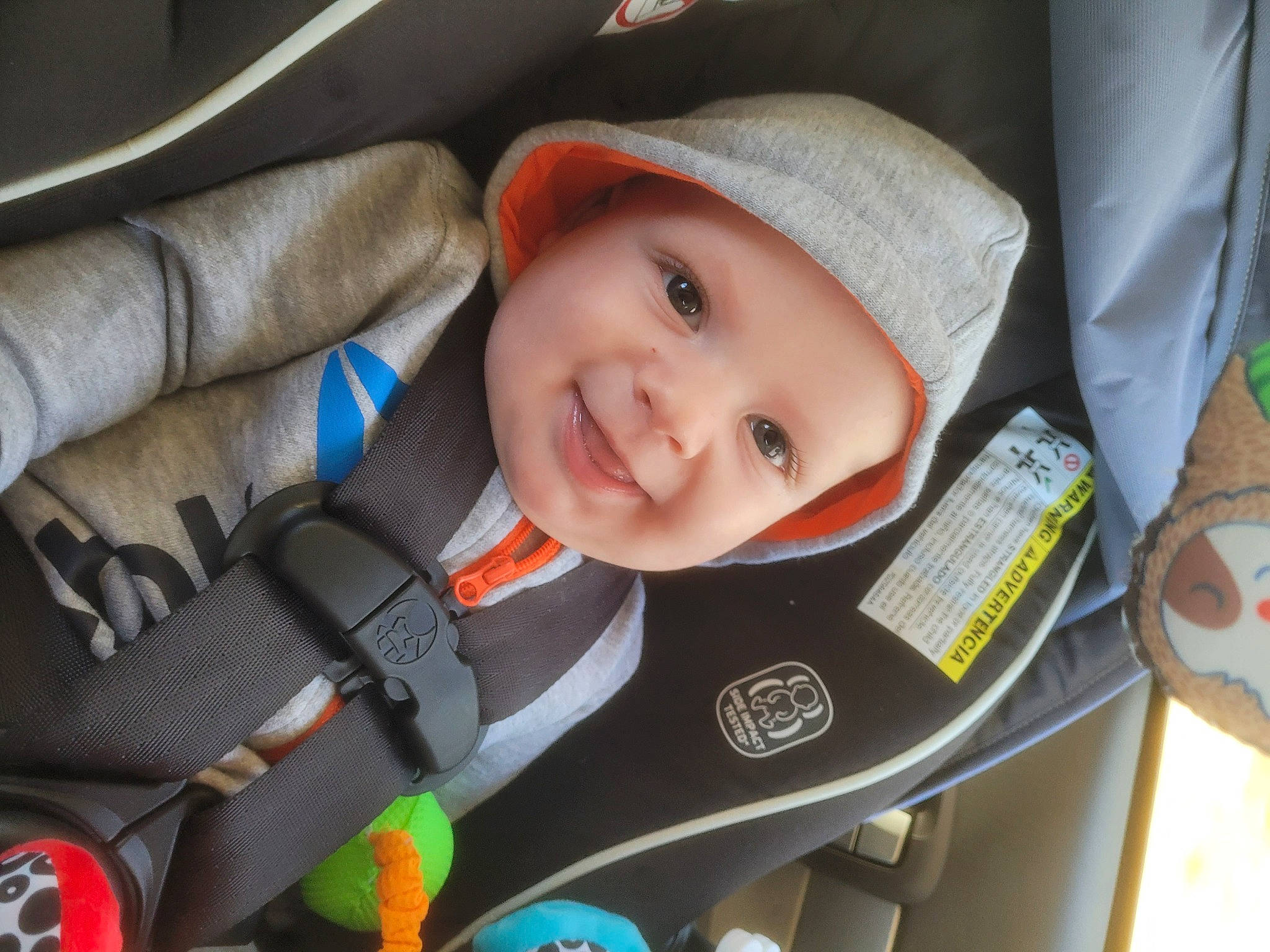 Benton is registered to the contest to win money with this photo: auto_part, automotive_design, baby, baby_carriage, baby_in_car_seat, baby_products, car, car_seat, car_seat_cover, child, comfort, family_car, headwear, joy, luxury_vehicle, motor_vehicle, person, product, seat_belt, smile