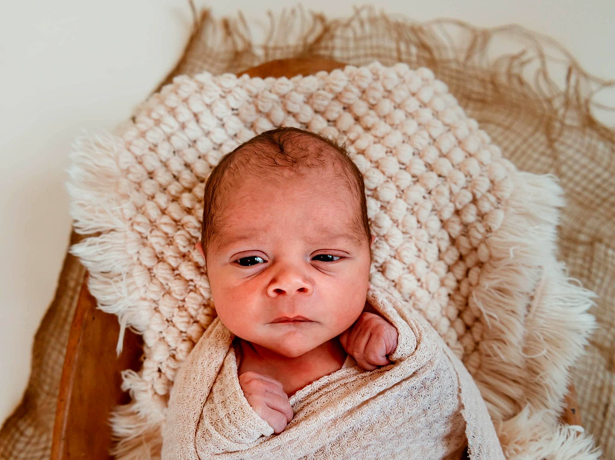 Jovan is registered to the contest to win money with this photo: baby, baby_products, baby_toddler_clothing, cheek, child, comfort, embellishment, face, fashion_accessory, hair_accessory, happy, iris, linens, pattern, peach, person, portrait_photography, textile, toddler, wool