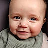 baby, child, smiling, face, blue_eyes, bib, clothing, portrait, close_up, infant, cute, happy, skin, hair, young, one_person, indoor, soft_light, expression, baby_bib