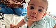 Thiago participe au concours pour gagner de l'argent avec cette photo : baby, bed, blanket, child, cozy, curly_hair, curtain, cute, expression, face, furniture, indoor, infant, light, person, reaching, sleepwear, soft_light, toddler, window