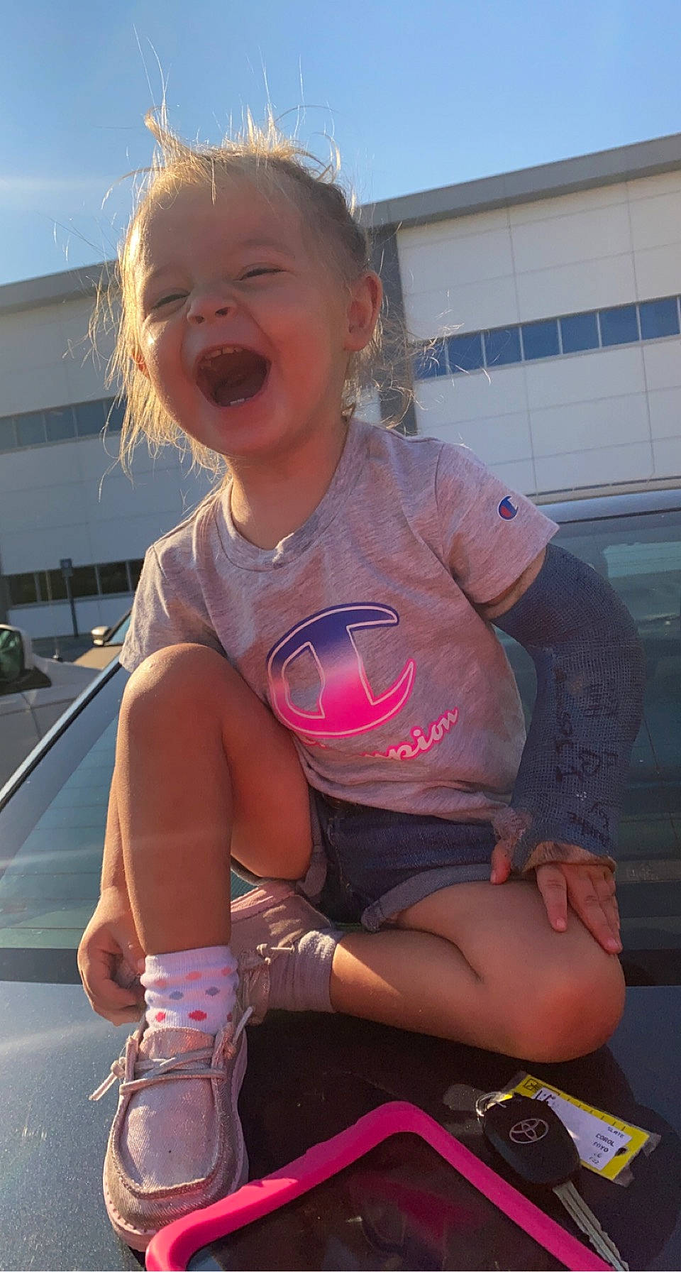 Lynnlee joined the competition — help win amazing prizes! automotive_lighting, cool, facial_expression, finger, hairstyle, happy, hood, human_body, motor_vehicle, mouth, person, pink, shorts, shoulder, skin, sky, smile, summer, thigh, toddler