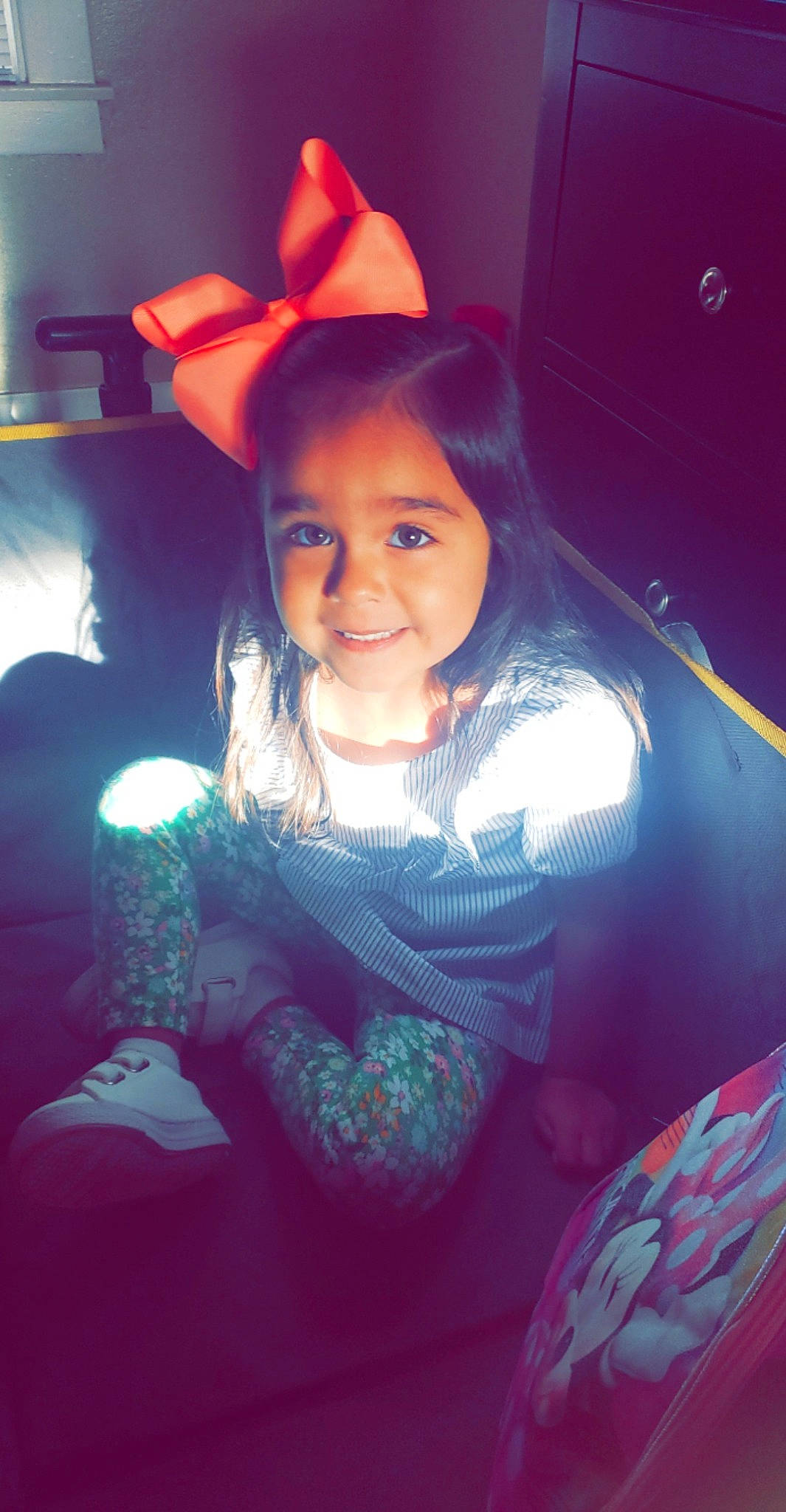 Gracie is registered to the contest to win money with this photo: beauty, child, cool, electric_blue, entertainment, event, fashion_accessory, flash_photography, fun, hairstyle, happy, human_body, iris, joy, lip, magenta, person, pink, purple, sitting