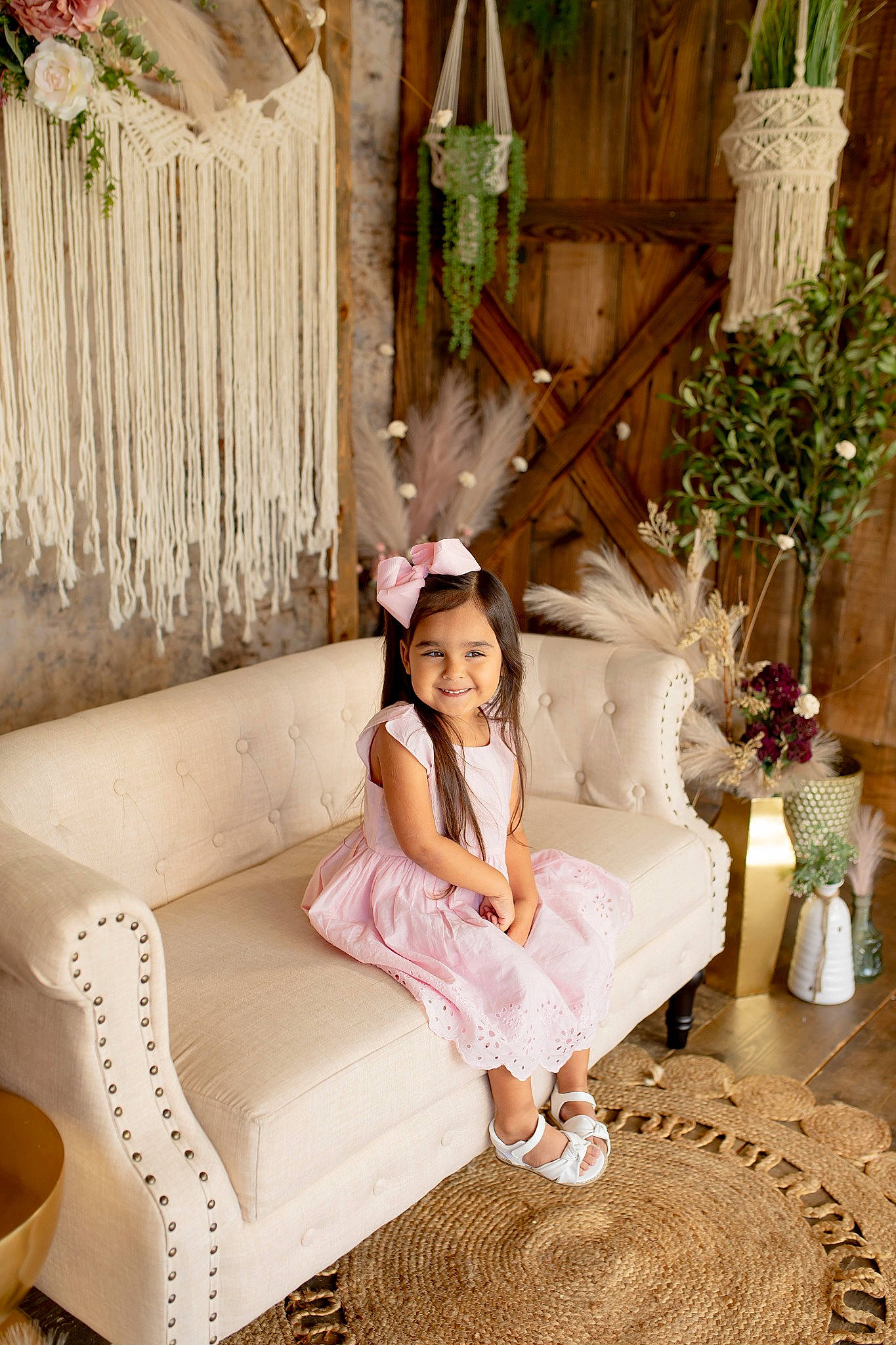 Gracie is registered to the contest to win money with this photo: child, comfort, couch, dress, event, fashion_design, grass, happy, hardwood, home, house, joy, leg, leisure, magenta, peach, person, plant, sitting, smile