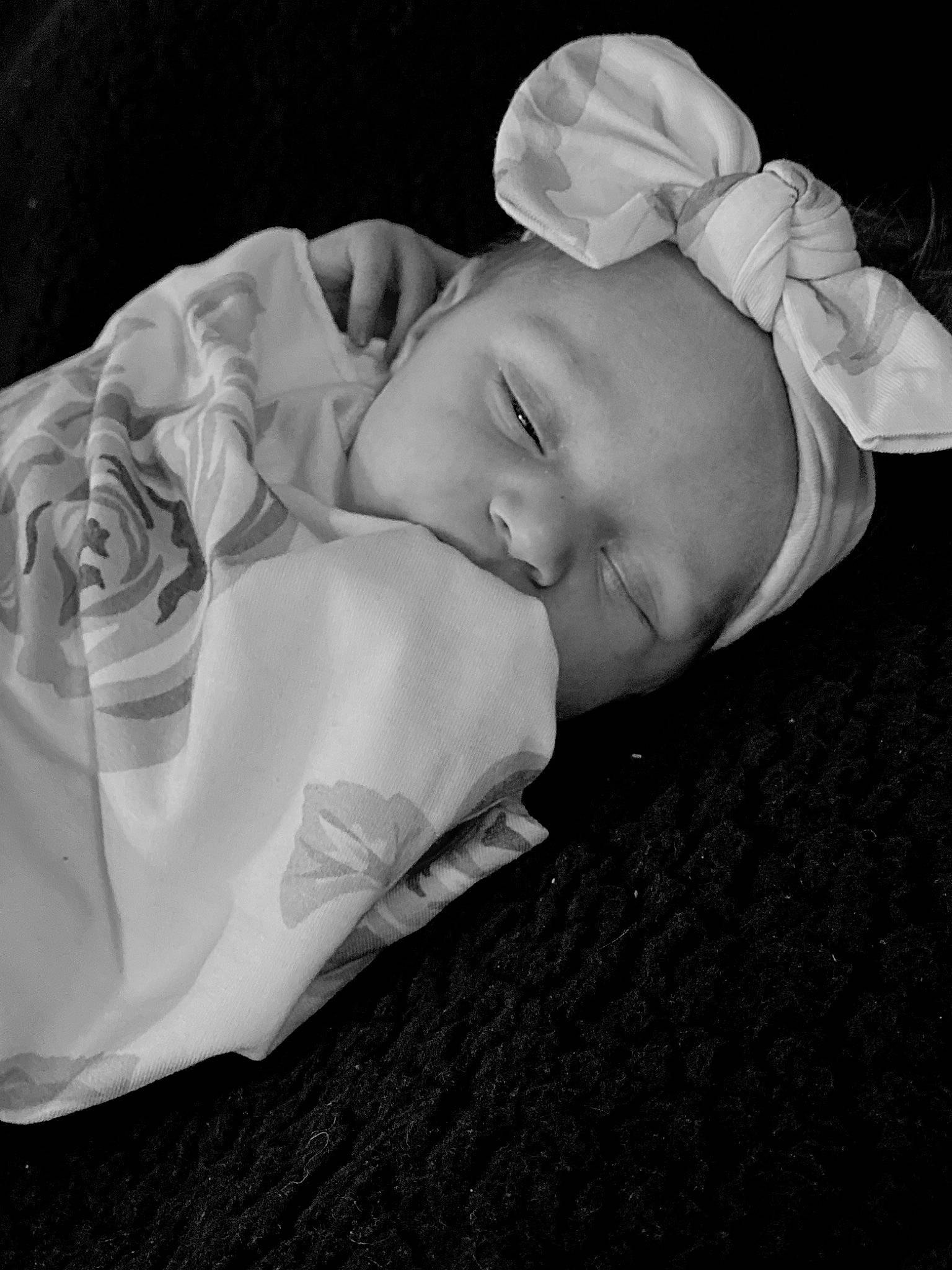 Raelynn is registered to the contest to win money with this photo: baby, baby_sleeping, baby_toddler_clothing, bedtime, child, comfort, darkness, flash_photography, font, grass, grey, happy, linens, monochrome, monochrome_photography, nap, person, portrait_photography, room, still_life_photography