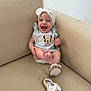 Blake joined the competition — help win amazing prizes! baby, smiling, couch, beige, headband, bow, sandal, clothing, infant, happy, cute, indoor, person, footwear, sitting, mickey_mouse, apparel, child, expression, comfort