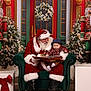 Waylon joined the competition — help win amazing prizes! baby, santa_claus, armchair, book, nutcracker, christmas_tree, wreath, holiday, festive, decorations, plaid_shirt, hat, lights, red_door, green_door, white_gloves, beard, boots, gift_box, indoor