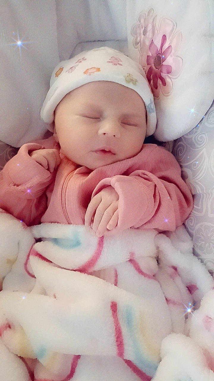 Rozalynia joined the competition — help win amazing prizes! baby, baby_products, baby_sleeping, baby_toddler_clothing, beanie, bedtime, cap, cheek, child, comfort, headband, headwear, linens, magenta, peach, person, pink, portrait_photography, room, skin