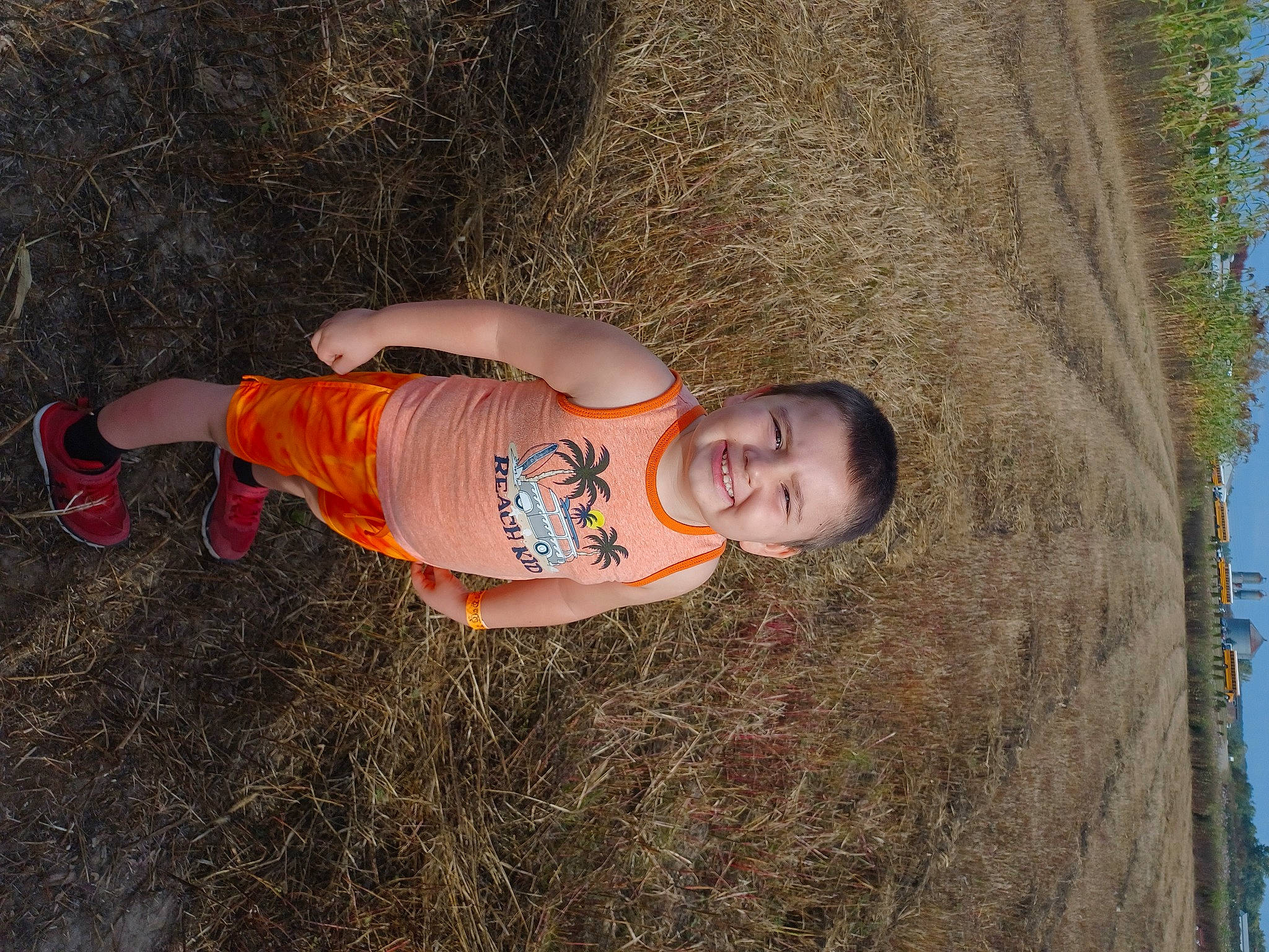 Bryce is registered to the contest to win money with this photo: baby, child, fun, grass, happy, hat, joy, landscape, people_in_nature, person, plant, recreation, sky, smile, soil, t_shirt, toddler, tree, trunk, wood