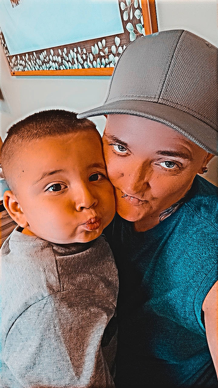 Bryce is registered to the contest to win money with this photo: baseball_cap, cap, child, cool, eyebrow, fashion_accessory, flash_photography, forehead, fun, gesture, happy, hat, jewellery, kiss, lip, love, nose, person, selfie, t_shirt