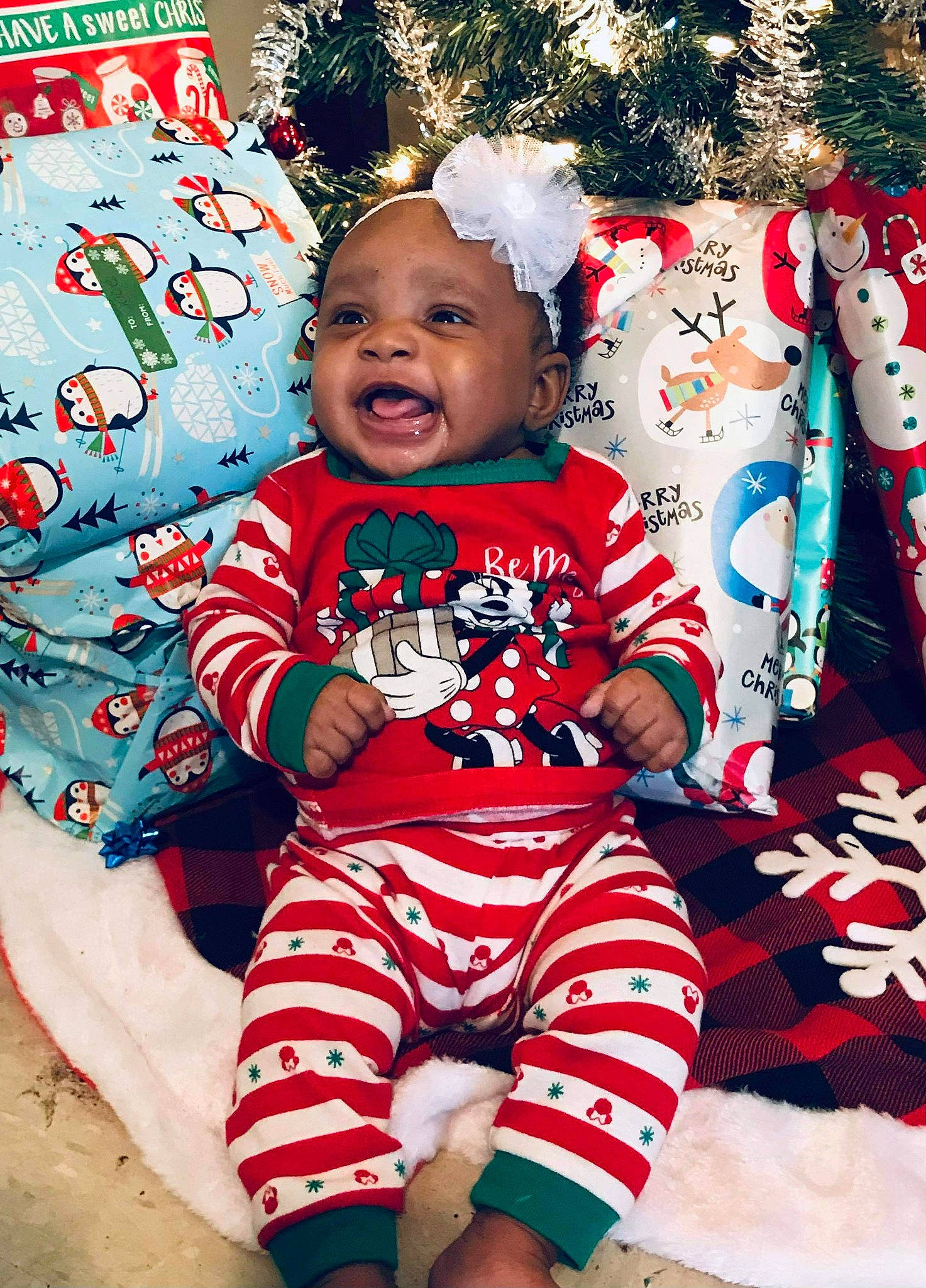 Derrianna is registered to the contest to win money with this photo: baby, baby_toddler_clothing, child, christmas, christmas_decoration, christmas_eve, christmas_ornament, christmas_tree, holiday, holiday_ornament, nightwear, nose, ornament, pajamas, person, sock, toddler