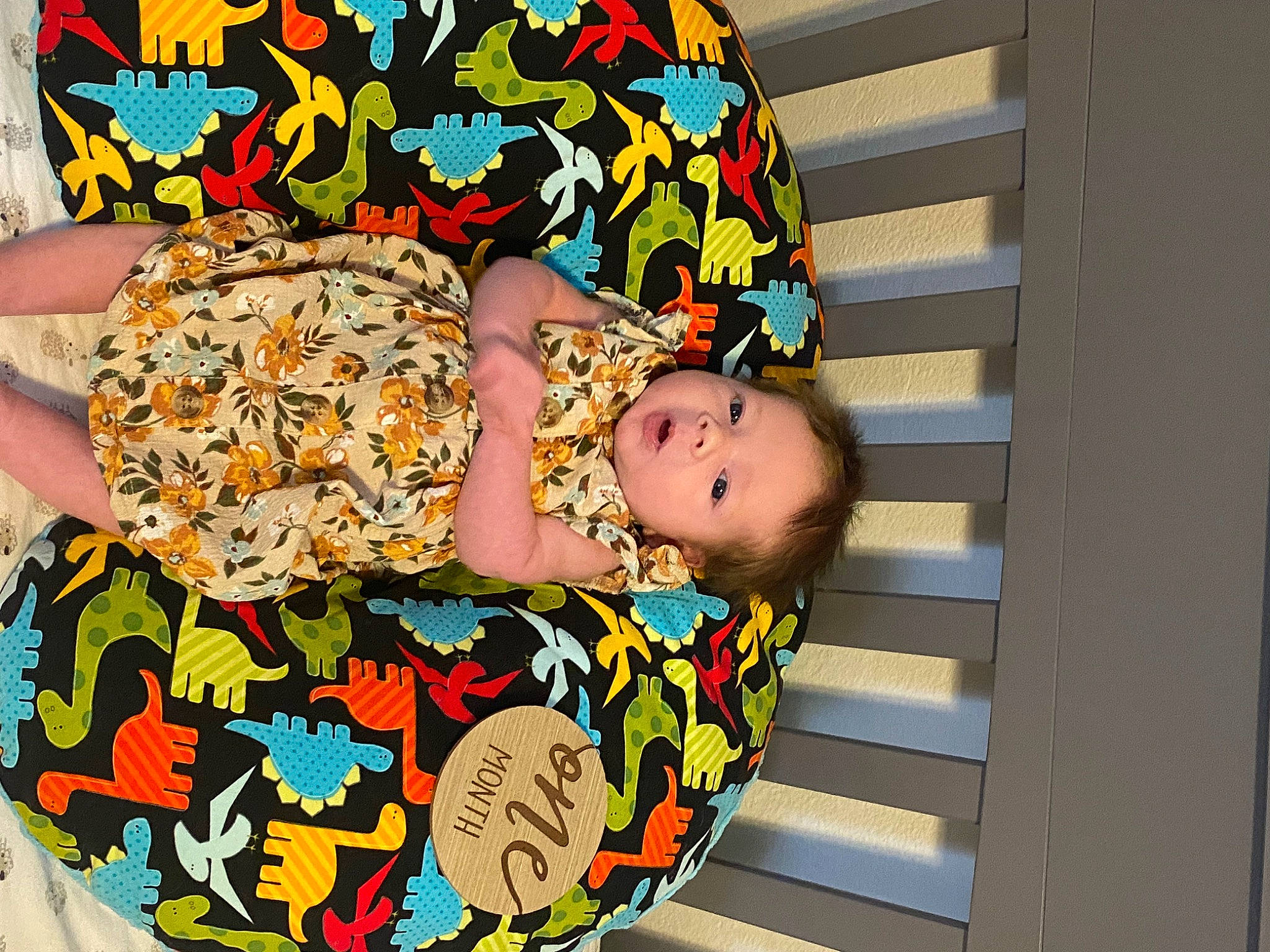 Johanna joined the competition — help win amazing prizes! baby, baby_products, baby_safety, baby_toddler_clothing, child, comfort, fun, happy, human_leg, pattern, person, room, sitting, sunglasses, thigh, toddler, wood