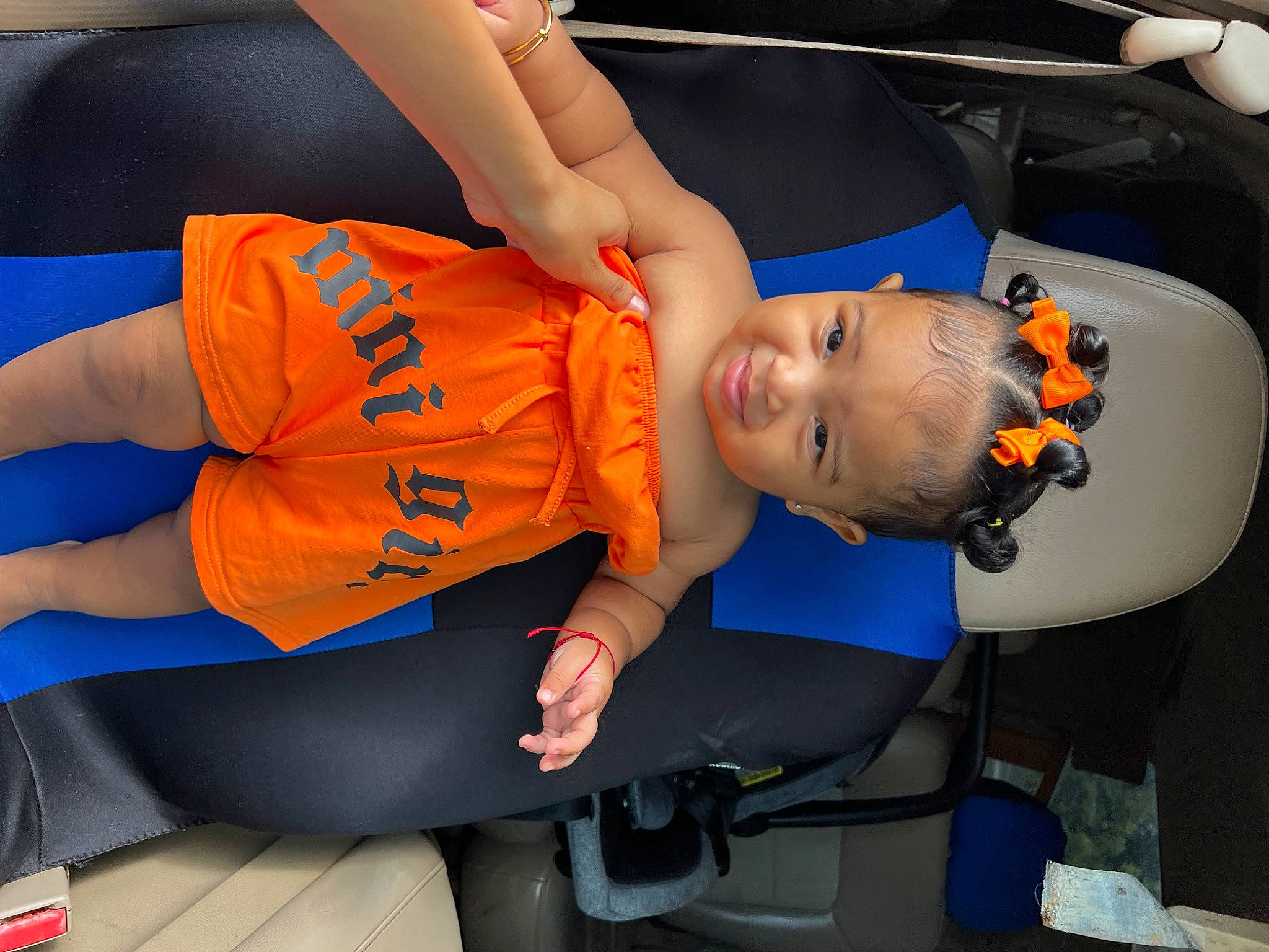 Indie is registered to the contest to win money with this photo: arm, automotive_design, child, elbow, electric_blue, fun, human_leg, joint, knee, leg, leisure, mouth, orange, person, recreation, shoe, sitting, sneakers, sportswear, t_shirt