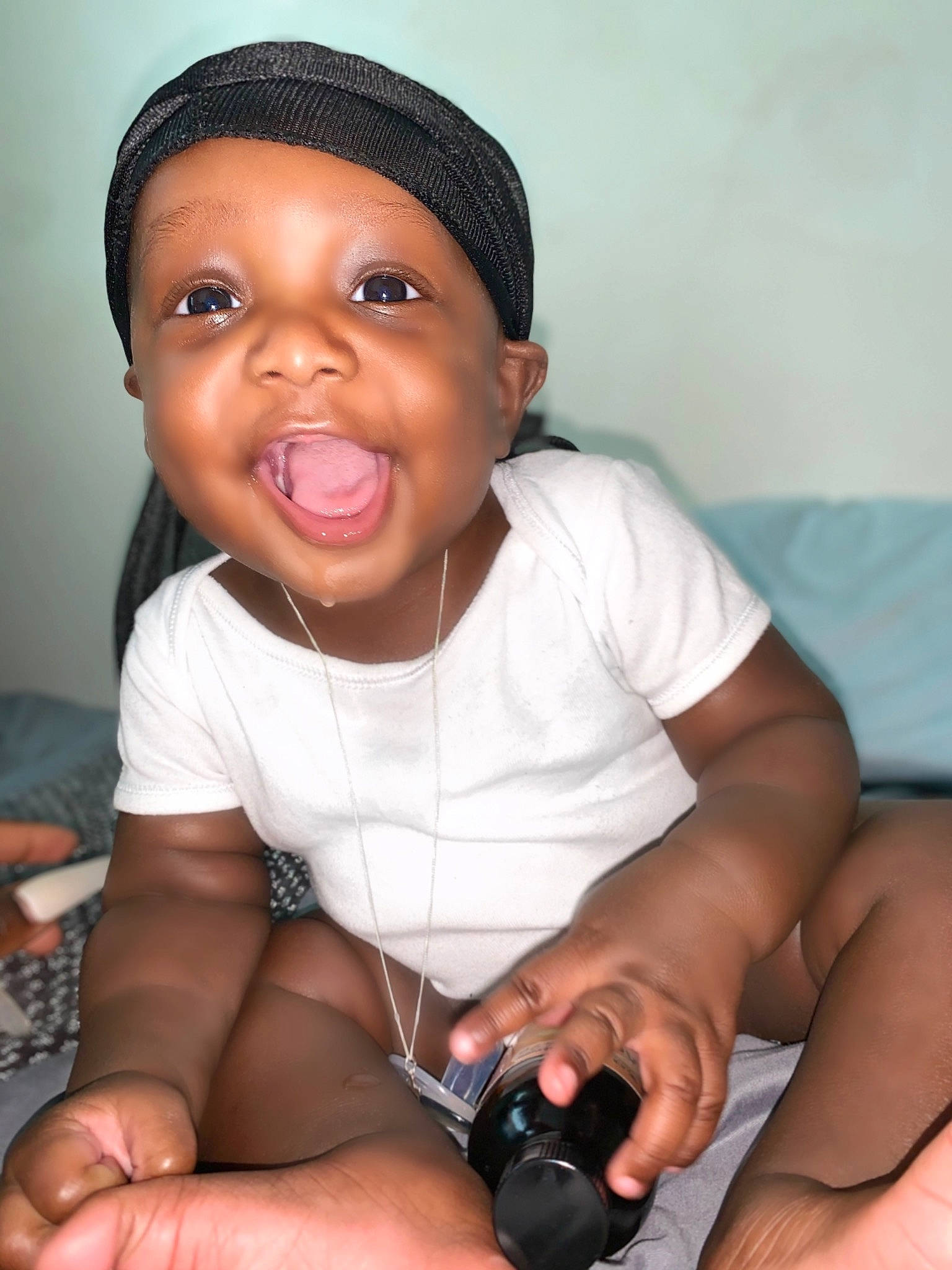 Jaziah is registered to the contest to win money with this photo: arm, baby_toddler_clothing, black, cap, cheek, chin, eyebrow, face, hand, human_body, iris, joint, lip, mouth, muscle, nail, neck, nose, person, skin