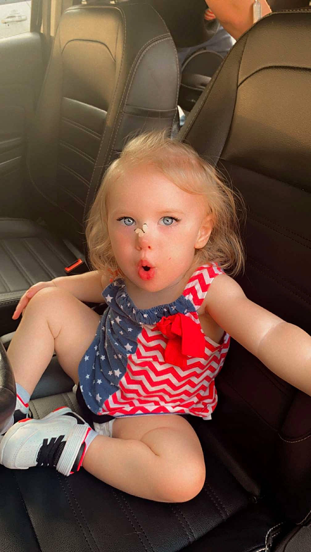 Hazel joined the competition — help win amazing prizes! arm, auto_part, automotive_design, baby_toddler_clothing, blond, car_seat, comfort, dress, finger, hair, human_body, human_leg, joint, knee, lap, leg, person, skin, thigh, toddler