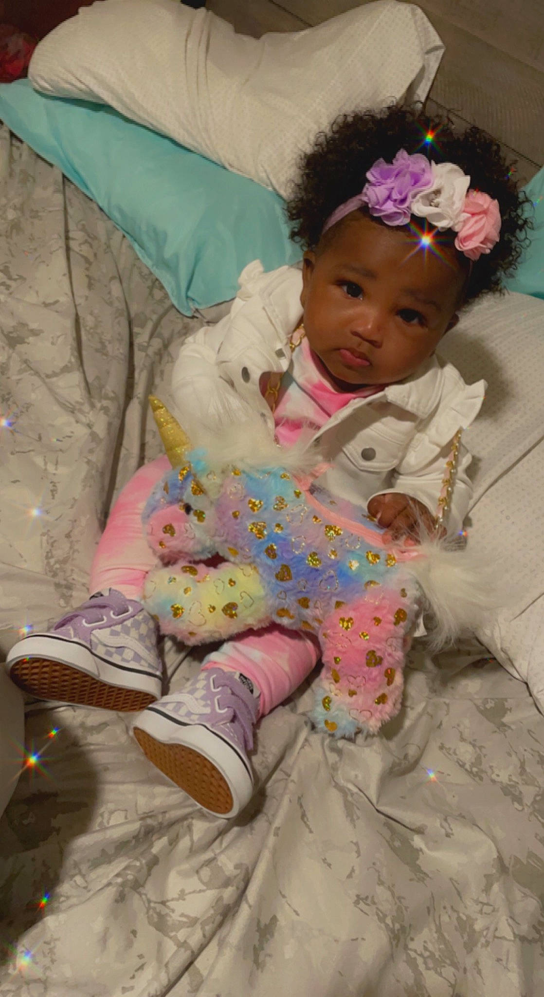 Journee is registered to the contest to win money with this photo: baby, baby_toddler_clothing, cheek, child, comfort, face, fashion_accessory, hair, happy, head, headband, headpiece, linens, person, pink, room, sitting, skin, sleeve, textile