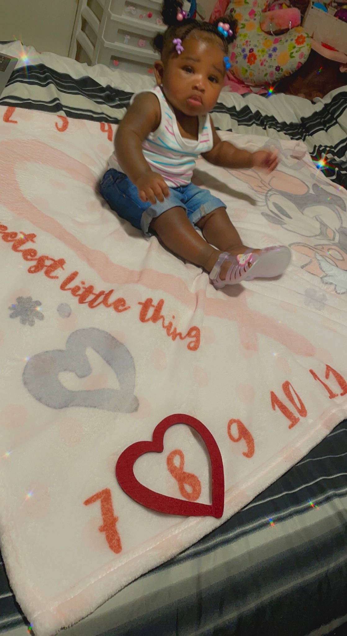 Journee is registered to the contest to win money with this photo: baby, bedding, carmine, chair, child, event, flooring, font, fun, handwriting, leisure, linens, person, play, recreation, red, room, shorts, sitting, t_shirt