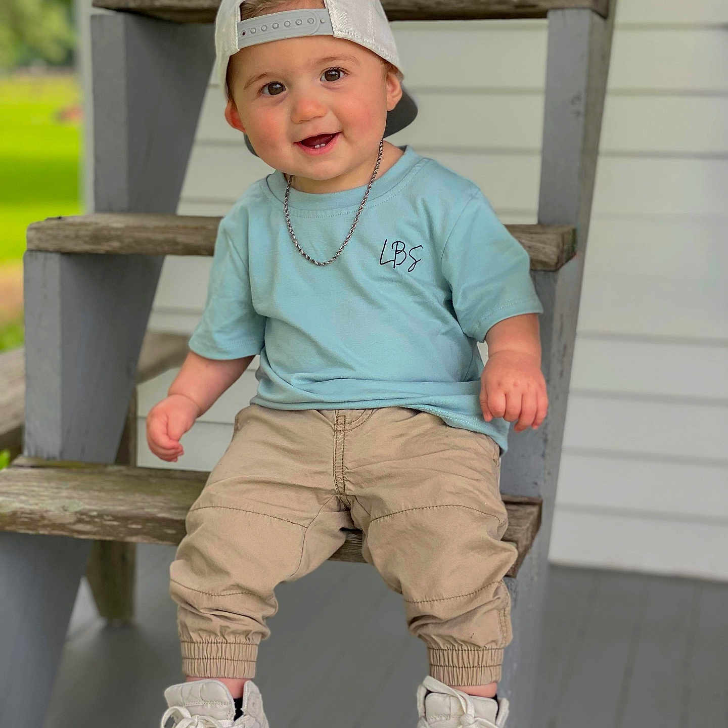 Jestin is registered to the contest to win money with this photo: accessories, boy, child, clothing, face, footwear, happy, hat, head, jeans, jewelry, male, pants, person, photography, portrait, shoe, sitting, sleeve, sneaker