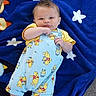 baby, infant, blanket, blue_blanket, stars, winnie_the_pooh, clothing, onesie, cute, lying_down, outdoor, footwear, smiling, face, head, hand, feet, person, toddler, playful