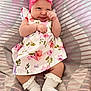 Esmée participe au concours pour gagner de l'argent avec cette photo : apparel, baby, blanket, child, cozy, cute, expression, fabric, floral_dress, headband, indoors, infant, lying_down, pink, portrait, small_hands, soft_lighting, striped, white_socks, young_child