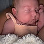 Esmée participe au concours pour gagner de l'argent avec cette photo : arm, baby, blanket, child, closeup, clothing, cozy, cute, face, hand, indoors, infant, nap, newborn, peaceful, person, rest, skin, sleeping, soft