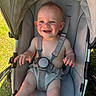 Tommy joined the competition — help win amazing prizes! baby, baby_clothing, baby_toy, cheerful, child, cute, grass, gray, happy, infant, one_person, outdoor, person, playful, seat, seatbelt, smiling, stroller, summer, sunlight