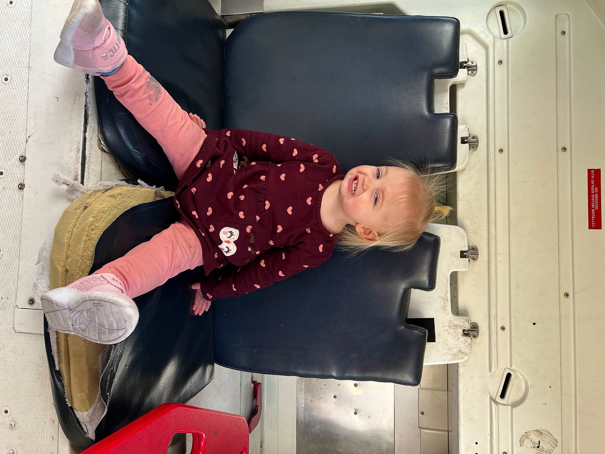 Eris is registered to the contest to win money with this photo: automotive_exterior, automotive_tire, baby_toddler_clothing, child, comfort, fun, gas, joint, joy, knee, machine, motor_vehicle, person, room, sitting, thigh, tire, toddler, vehicle, vehicle_door