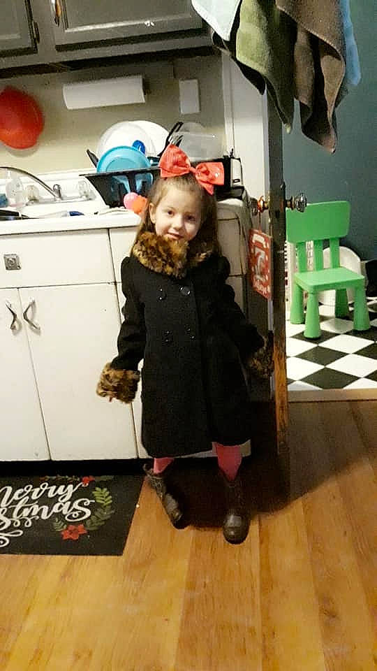 Lana is registered to the contest to win money with this photo: outerwear, person, room, shoe, standing